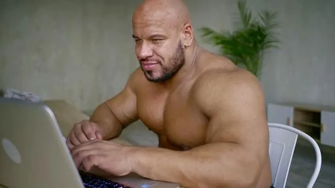 Buff guy typing 