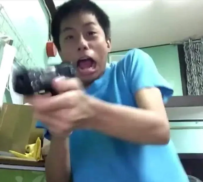 Dude gets scared and shoots the TV screen 