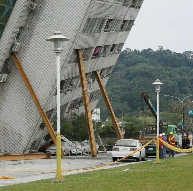 Falling building held up with sticks
