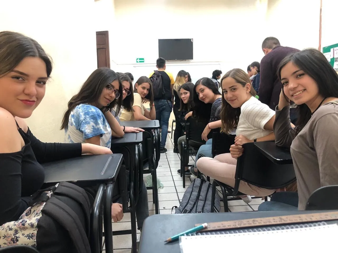 Girls in class looking back 