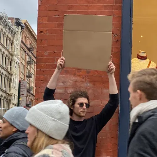 Guy Holding Cardboard Sign 