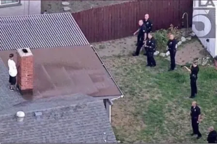 Guy hiding from cops on roof 