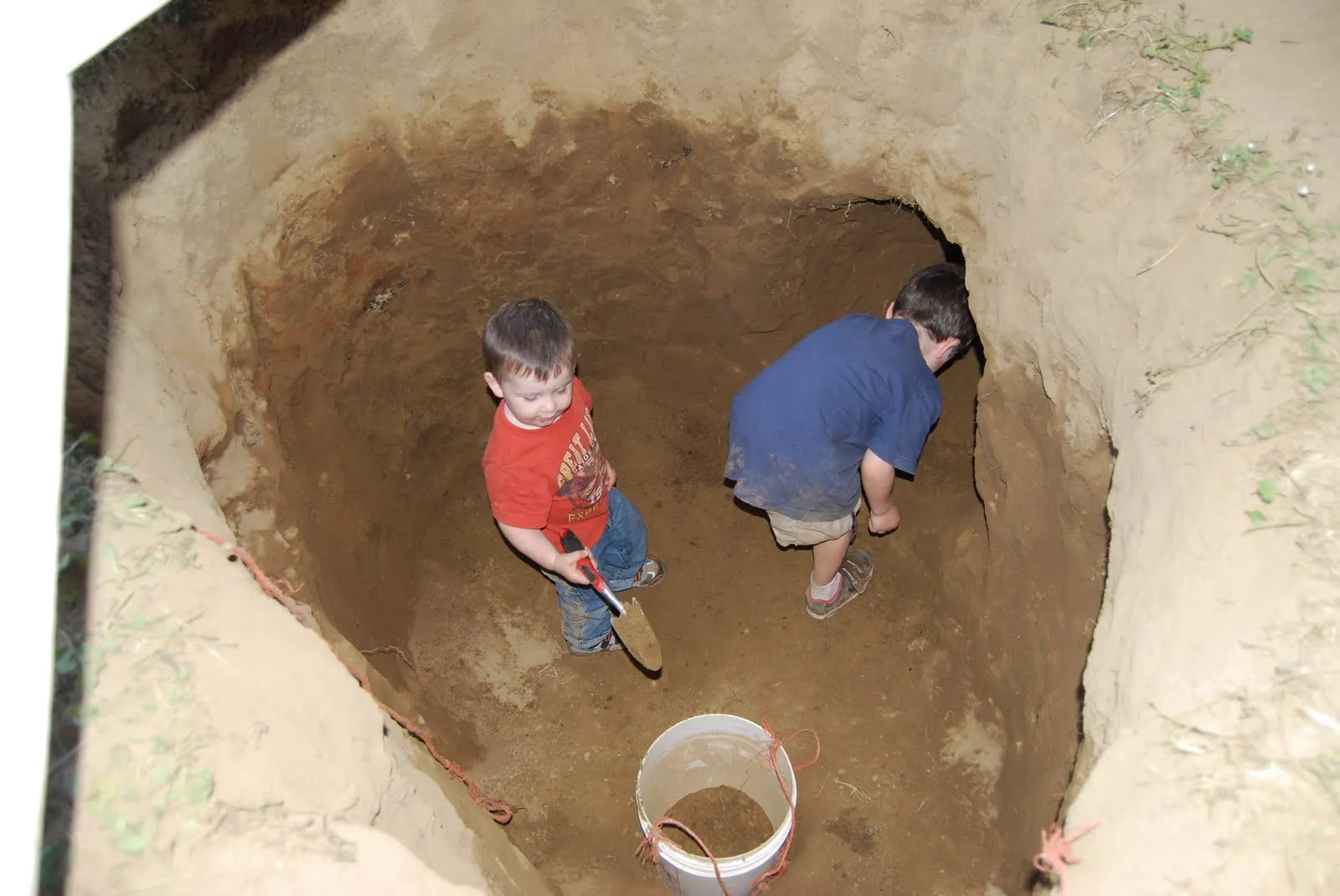 Kids digging a hole 