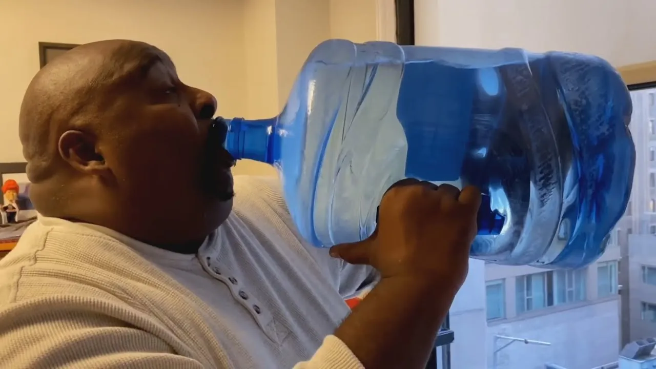 Man chugging water 
