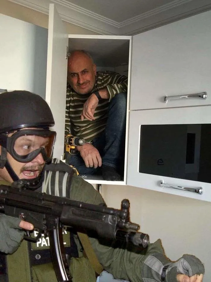 Man hiding in cabinet 