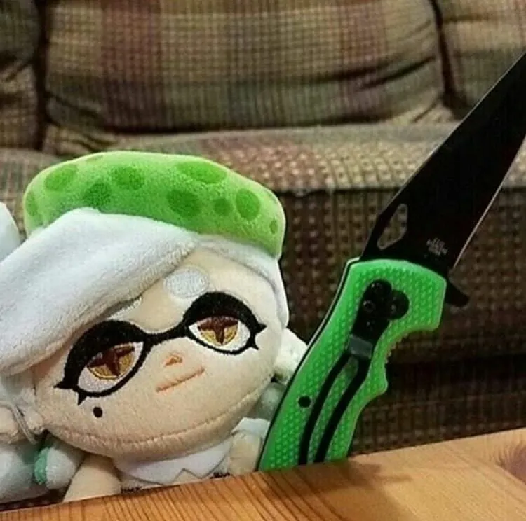 Marie plush with a knife 