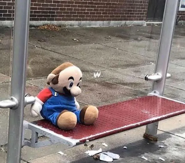 Plush Mario on bus stop 