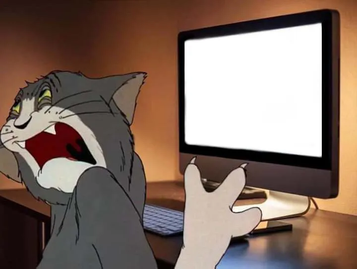 Tom looking away from computer 