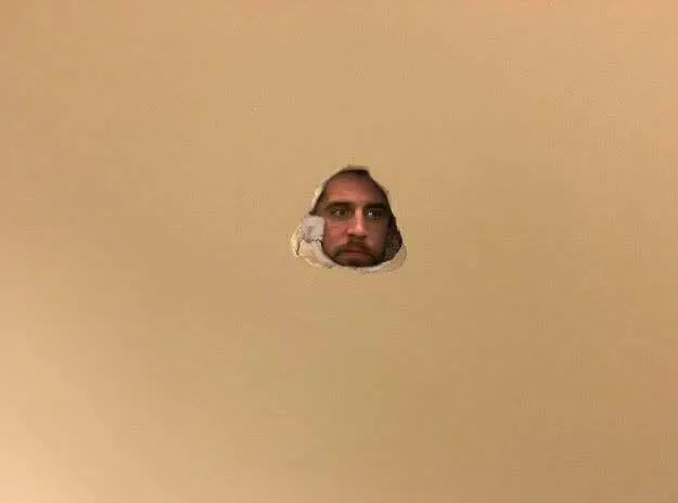 arron rodgers hole in wall 