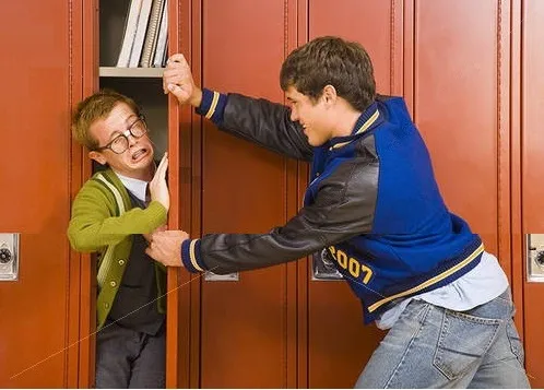 bully shoving nerd into locker 
