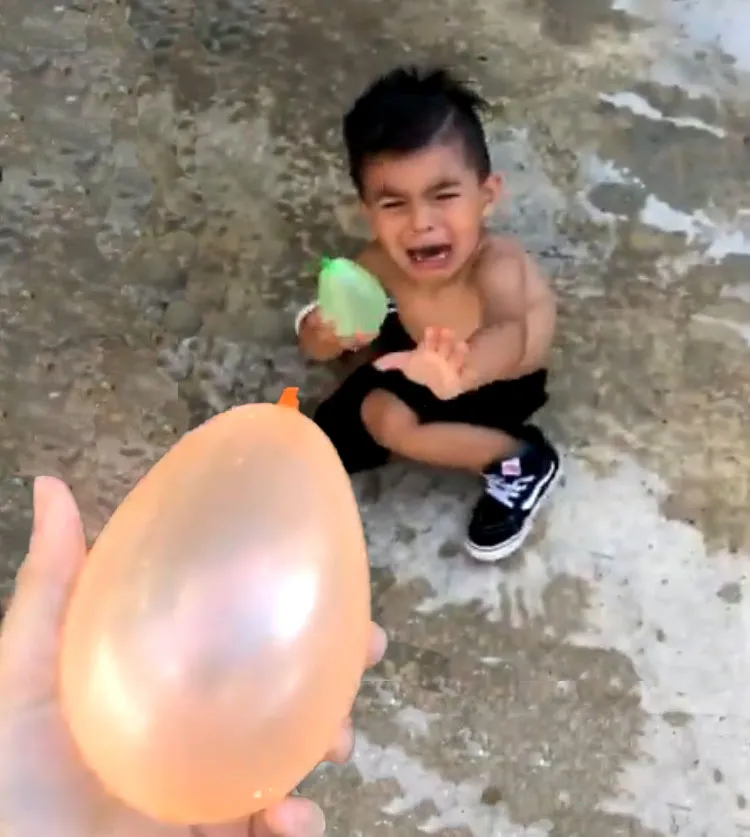 crying kid water balloon 