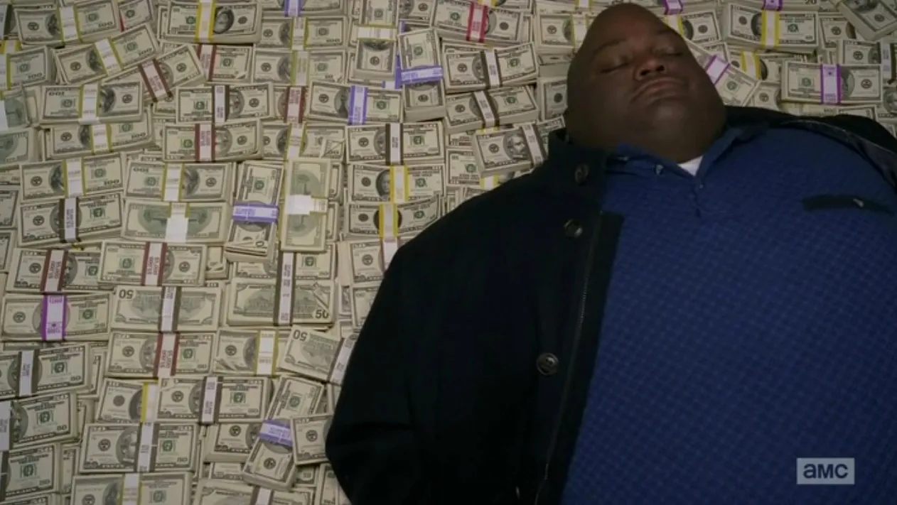 guy sleeping on pile of money 