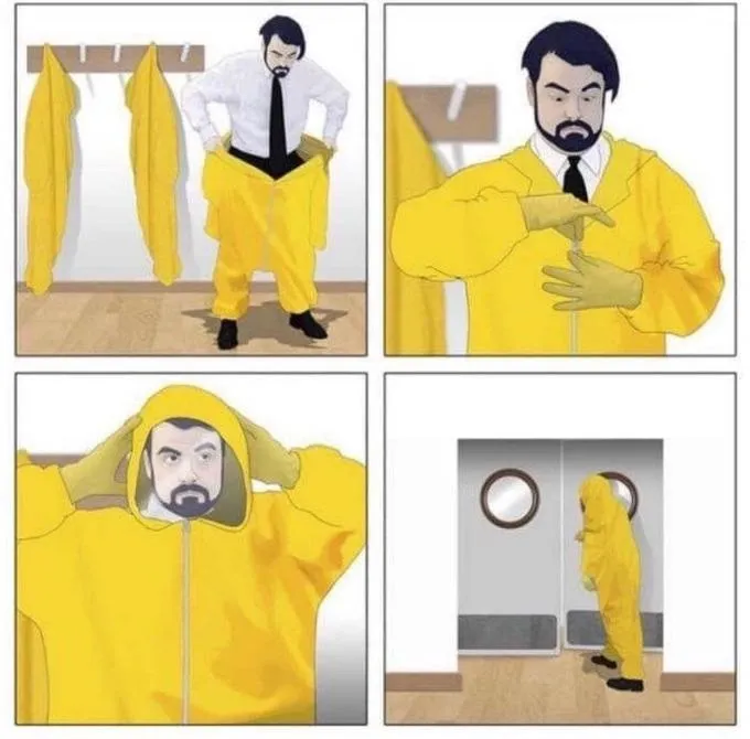 man putting on hazmat suit 