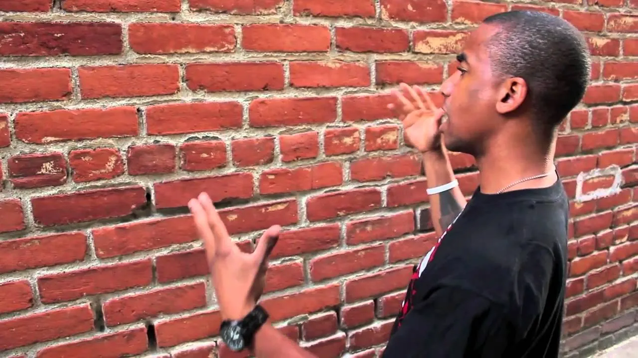 man taking to a wall 