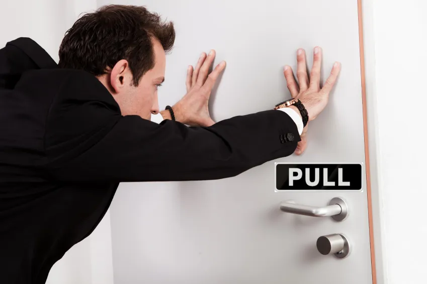 pushing a pull door 